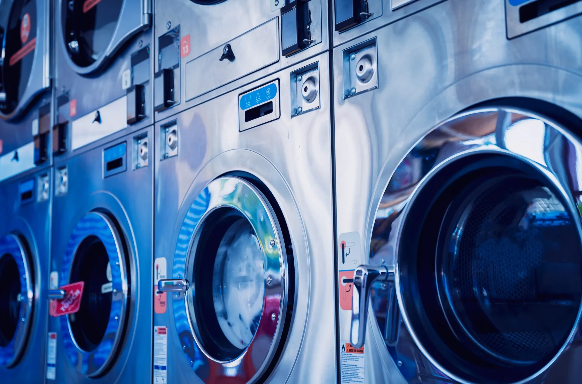 rows of industrial laundry machines